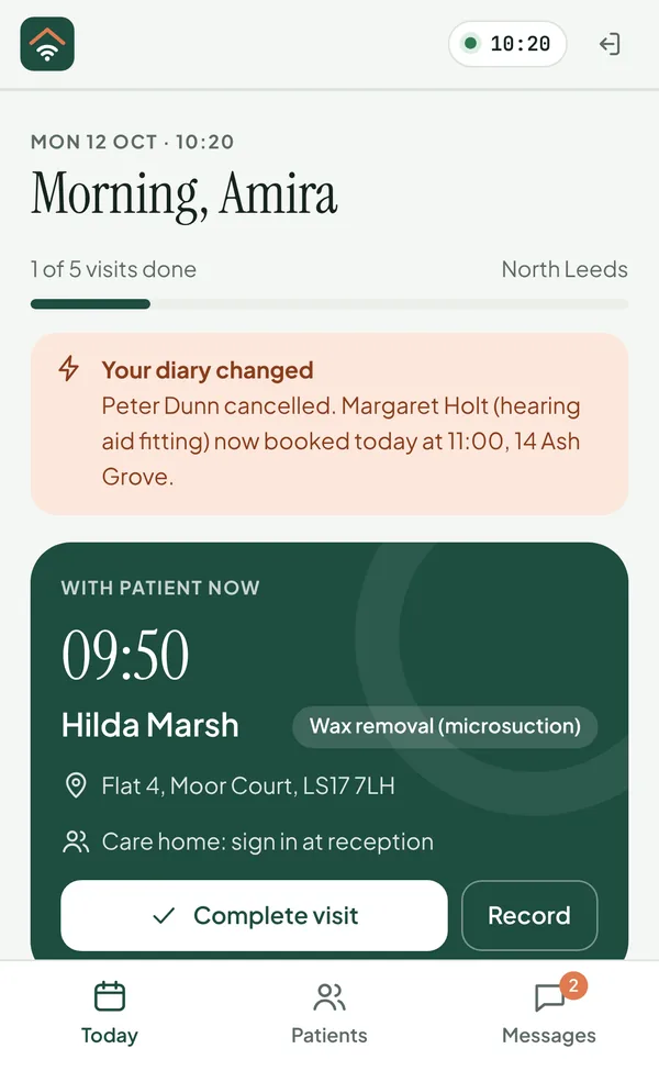 The clinician's phone: 'Your diary changed. Peter Dunn cancelled. Margaret Holt now booked today at 11:00, 14 Ash Grove.'