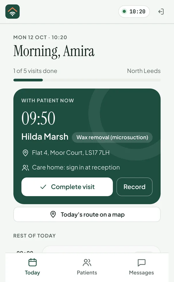 The clinician's day on a phone: the patient they're with now, the address, care-home sign-in, and buttons to complete the visit or open the record.