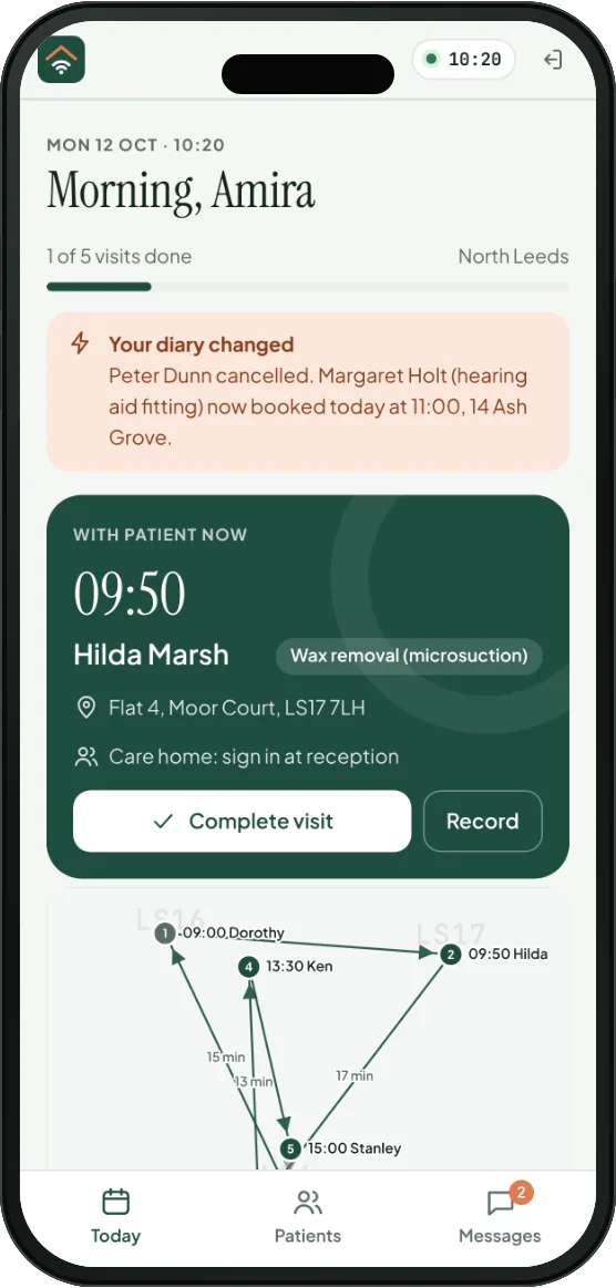 A phone showing the clinician's day: 'Your diary changed. Peter Dunn cancelled. Margaret Holt now booked today at 11:00', with the patient she's with now.