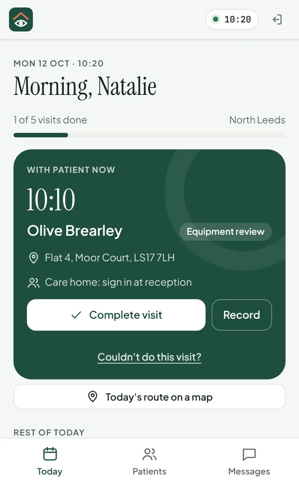 The OT's day on a phone: the person they're with now and the visit, with buttons to complete it.